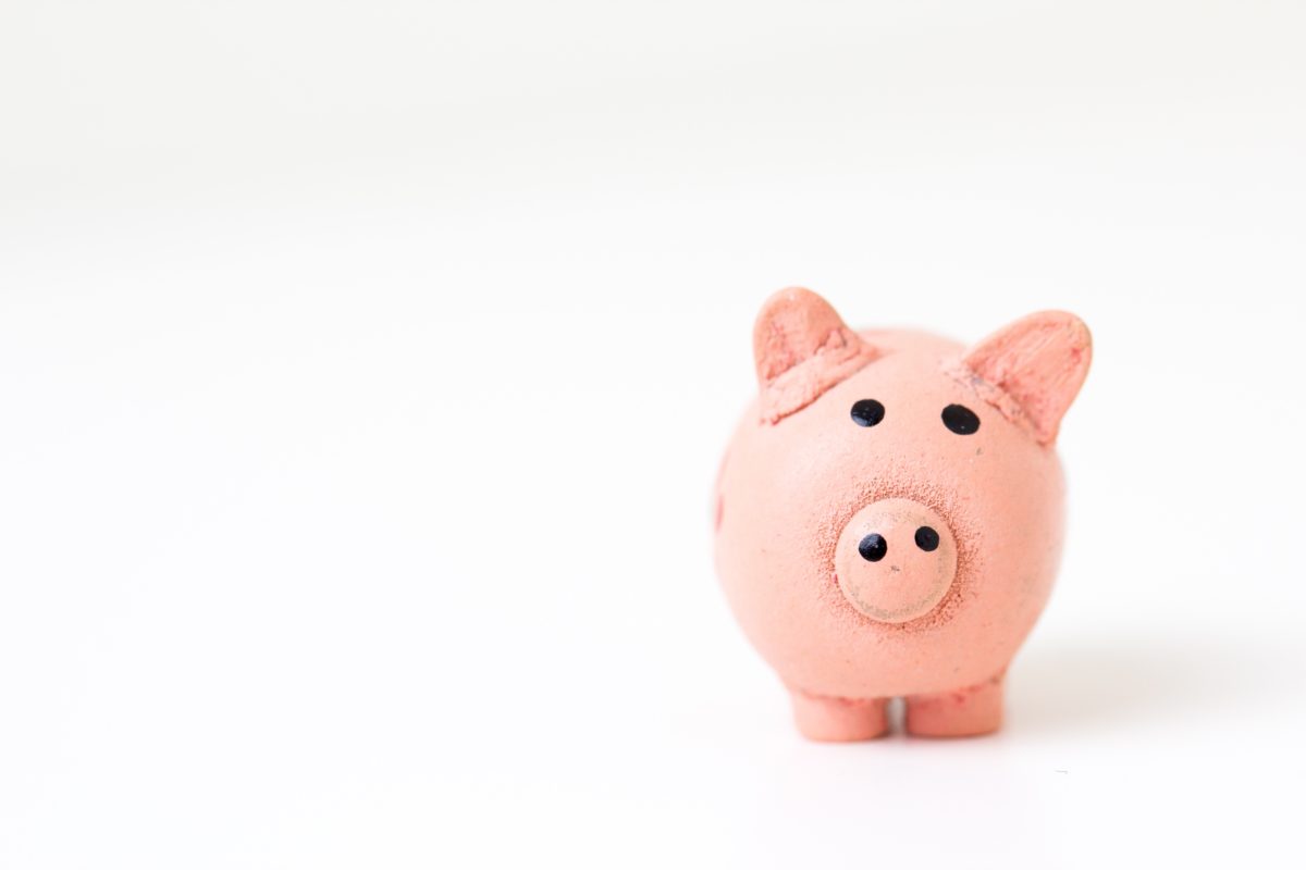 pink piggy bank for saving on title insurance